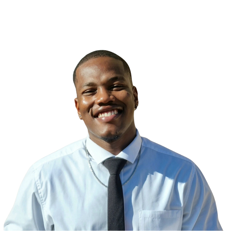 Lebone Rachidi smiling in a white shirt and black tie